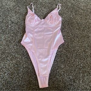 Shiny pink bodysuit